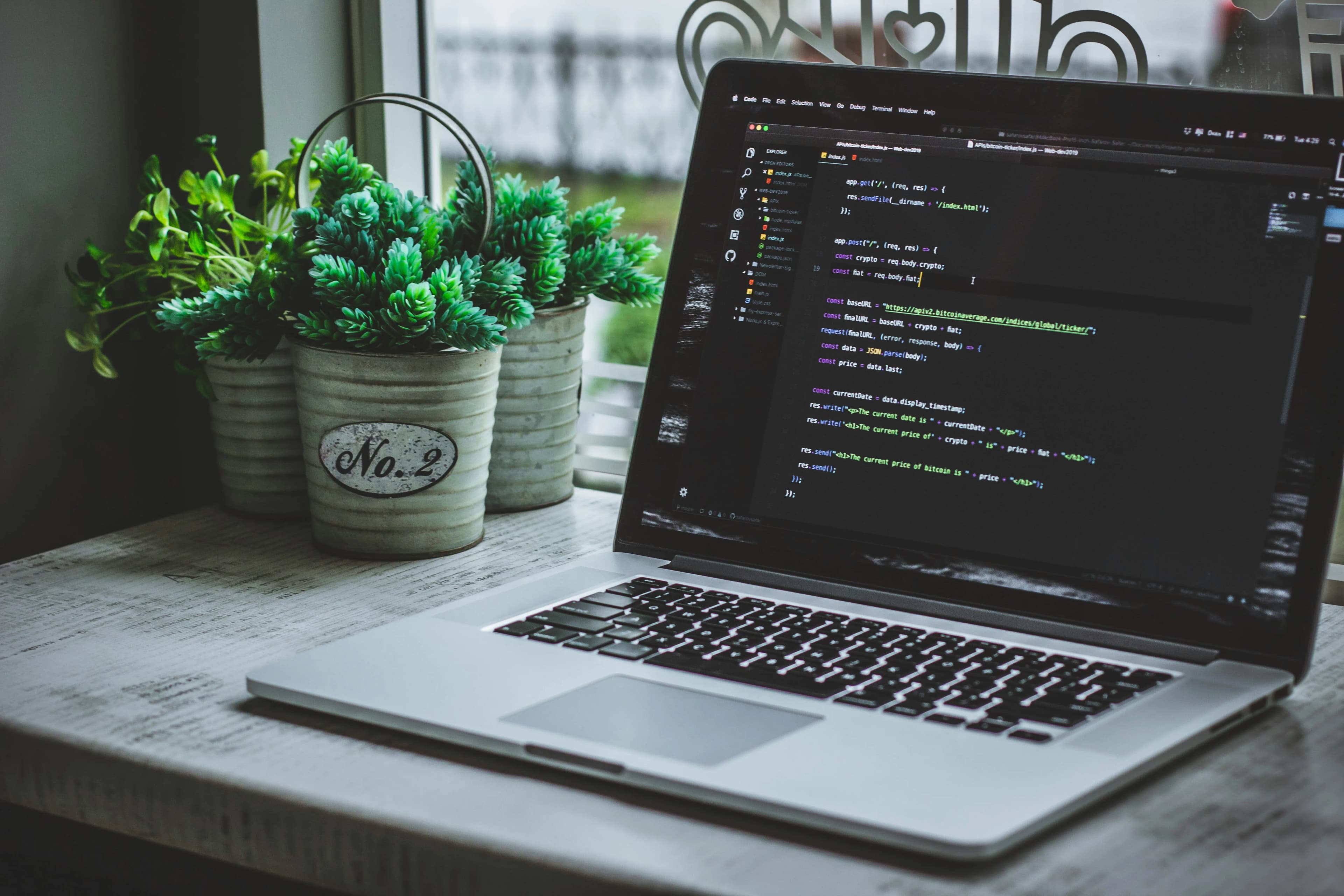 Developer workspace with application code on screen — app development by Final Orbit